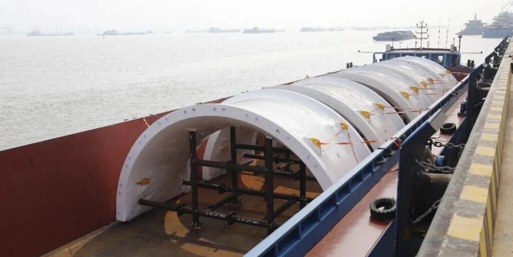 Grinding mill shells loaded onto barge for shipment 1