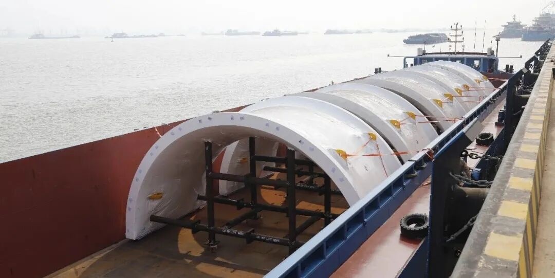 Grinding mill shells loaded onto barge for shipment
