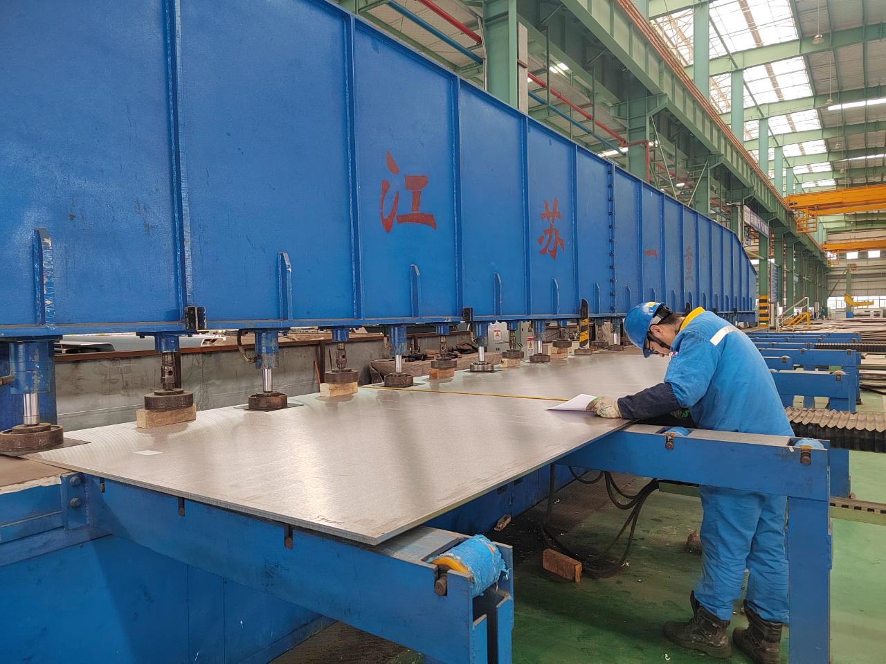 Precision sheet processing in progress on automated production line Precision sheet processing in progress on automated production line