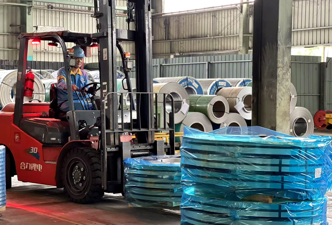 Forklift handling packed products for loading