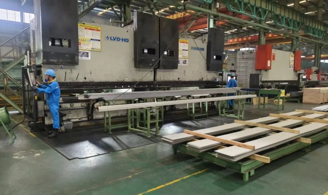 Large scale press bending process for long length stainless steel components