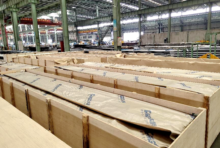 Sheet metal components packed in wooden crates for safe transportation
